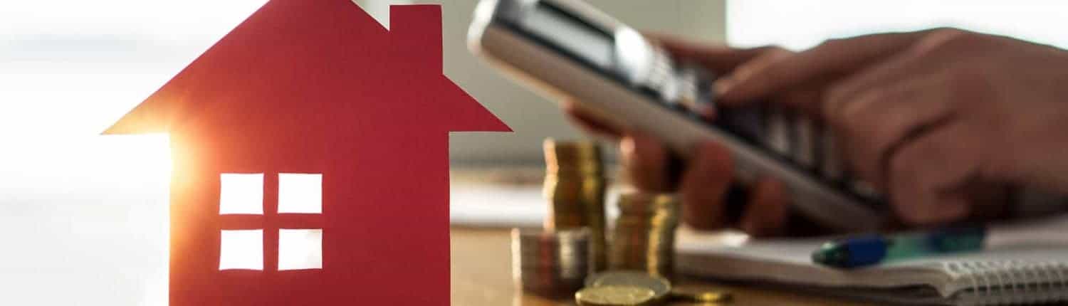 selling-a-house-concept-red-carboard-house-on-a-table-1500x430